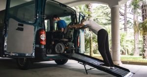 individual being helped out of disability-friendly van